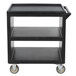 A black Cambro three shelf service cart with wheels.