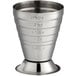 A stainless steel measuring jigger with numbers on it.