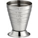 A stainless steel measuring jigger with numbers on it.