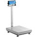 An AvaWeigh digital receiving scale with a tower display.