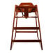 A wooden high chair with a seat and back.
