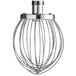 A silver metal wire whisk attachment for an Avantco mixer.
