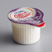 A close up of a small white container of Nestle Coffee-Mate Italian Sweet Creme with a red and white label.