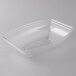 A clear plastic container with a curved bottom.