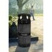 A black Ex-Cell Kaiser Landscape Series trash can with a black dome lid.