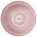 A pink porcelain bowl with a white rim.