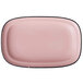 A pink rectangular porcelain platter with black trim.