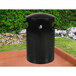 An Ex-Cell Kaiser black round trash receptacle with a dome lid