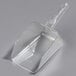 a plastic scoop on a white surface