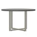 A round Safco Mirella conference table with a stone grey top and metal legs.