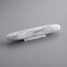 A white marble French rolling pin on a grey surface.