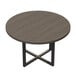 A Safco Mirella round conference table with a black cross base and wooden top.