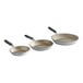 A group of three Vollrath Wear-Ever aluminum non-stick frying pans with black silicone handles.