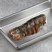 a lobster tail on a metal tray