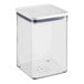 A clear square plastic food storage container with a white lid.