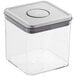 An OXO Good Grips clear square plastic food storage container with a stainless steel lid.