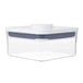 A clear plastic OXO Good Grips mini square food storage container with a white lid.