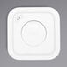 A white square OXO Good Grips POP label with a circle on it.