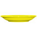 A yellow International Tableware saucer on a white background.