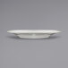 An International Tableware ivory stoneware plate with a wide rim.