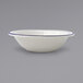 A white stoneware bowl with blue bands.
