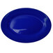 A cobalt blue International Tableware stoneware platter with a wide rim.
