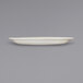 An International Tableware Valencia ivory stoneware platter with a narrow rim on a gray surface.