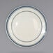 An International Tableware Catania stoneware plate with blue bands on the rim.