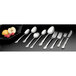 A close-up of a Vollrath stainless steel spoon and fork.
