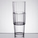 A stack of Arcoroc  Norvege beverage glasses on a table.