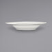 An International Tableware Athena stoneware deep rim soup bowl with a rolled edge and embossed design on a white surface.
