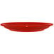 A crimson red International Tableware stoneware plate on a white background.