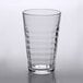 a clear glass with a white lid