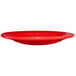 A International Tableware crimson red stoneware plate with a wide rim.