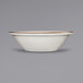 An International Tableware white stoneware fruit bowl with brown speckles on the rim.