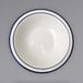 An International Tableware Danube stoneware fruit bowl with blue bands on the rim.