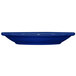 A cobalt blue stoneware narrow rim saucer on a white surface.