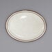 An International Tableware ivory stoneware platter with brown speckled edges and a narrow brown rim.