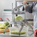 A woman using a Garde lettuce chopper to cut lettuce.