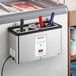 A Server ConserveWell heated dipper well with a red and blue handle on a counter.
