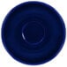 A cobalt blue stoneware saucer with a rim and circle in the middle.