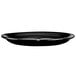 A black International Tableware Cancun narrow rim platter on a white background.