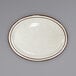 An International Tableware ivory stoneware platter with brown speckled edges.