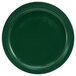 A close-up of a green International Tableware Cancun stoneware plate with a rim.