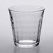 A clear Duralex stackable glass tumbler with a textured pattern.