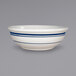 A close up of an International Tableware Catania stoneware bowl with blue stripes.