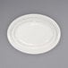 An ivory stoneware platter with a rolled edge and embossed pattern.