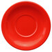 a red plate with a circle in the middle