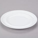 a white plate on a gray surface