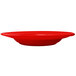 A crimson red stoneware pasta bowl on a white background.